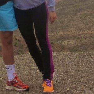 Lululemon Black leggings with Purple Stripe. Sz 4